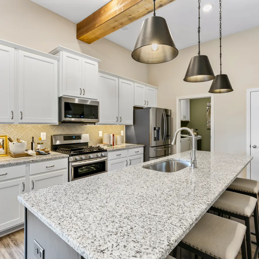 a kitchen with white cabinets