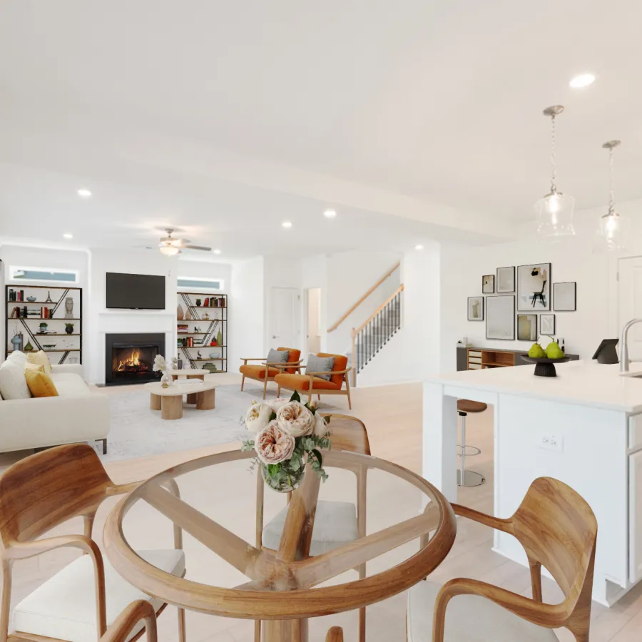 Bright open living room and kitchen with modern furniture, glass dining table, fireplace, and hardwood floors.