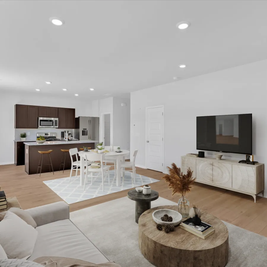 Modern open living space with beige sofa, wooden coffee table, TV stand, dining area, and dark kitchen cabinets.
