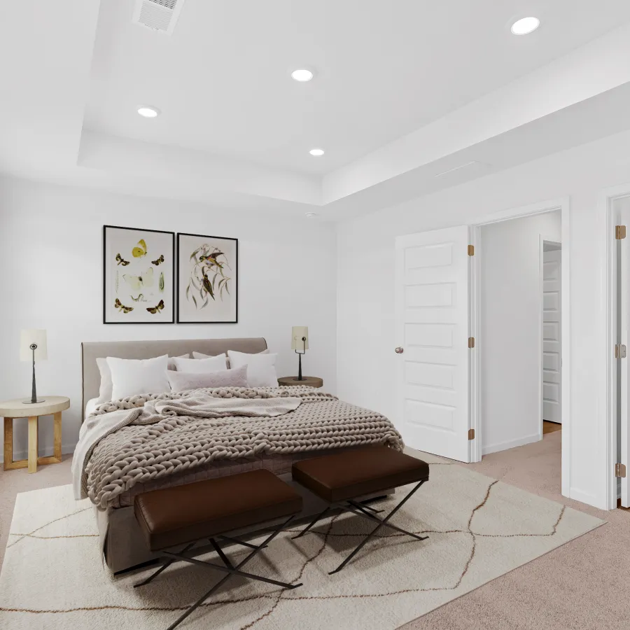 Bright modern bedroom with neutral tones, king bed, decorative pillows, bench, and artwork above the headboard
