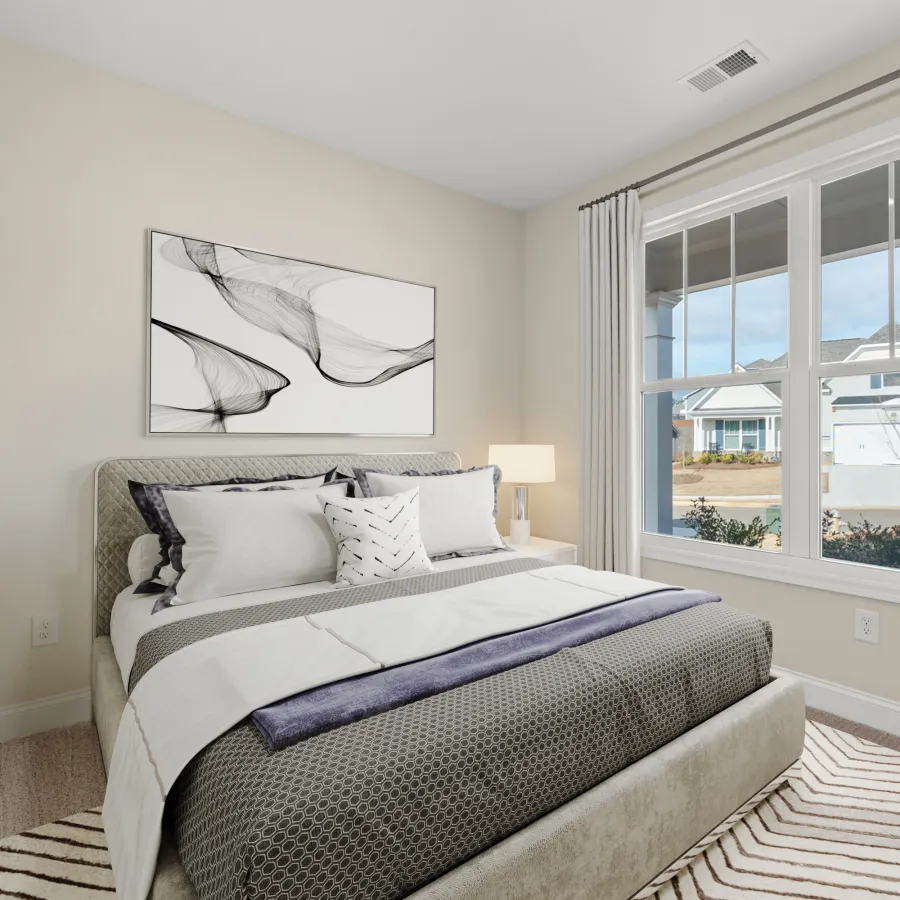 a bedroom with a large window