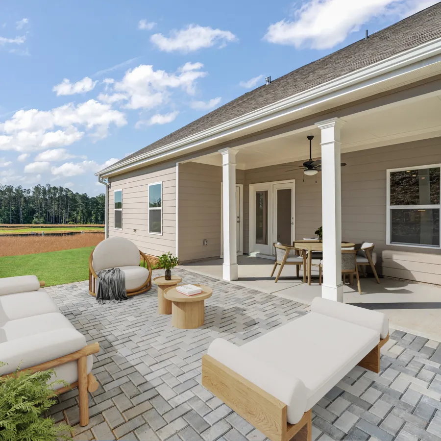 a house with a patio and a table and chairs
