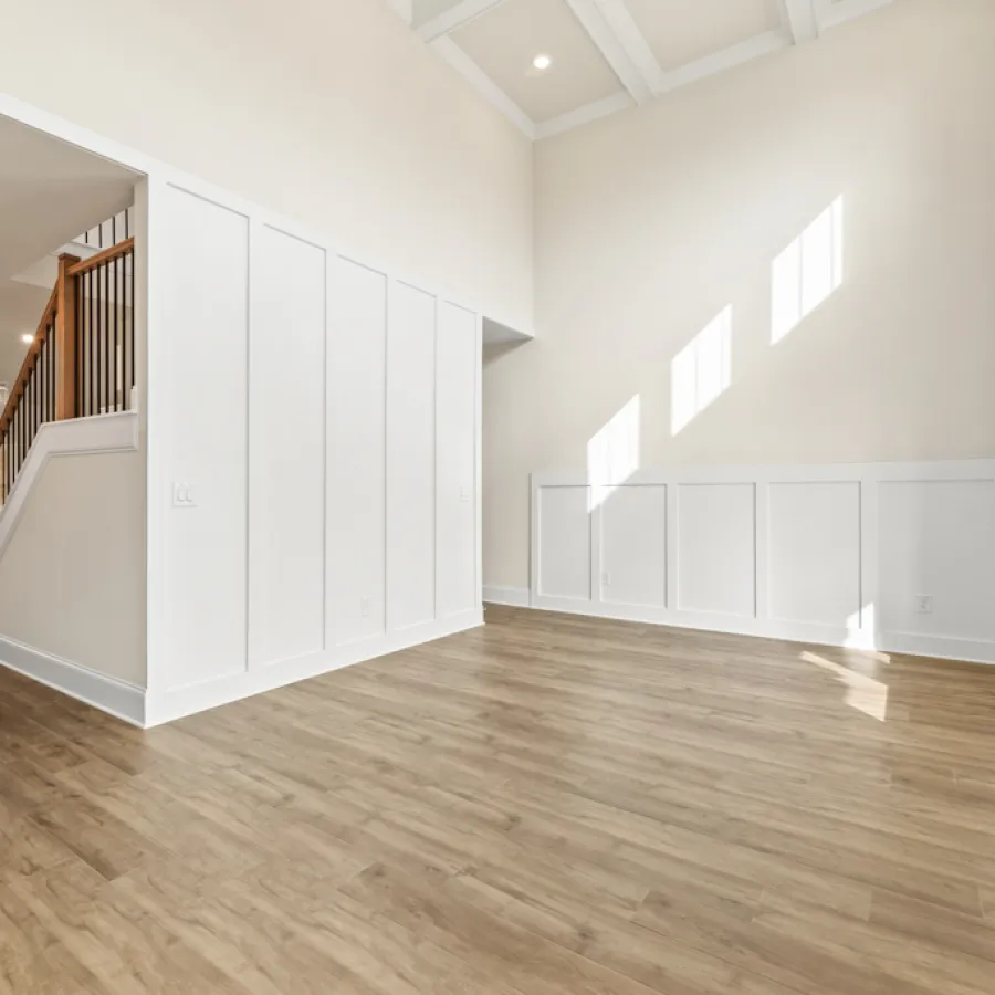 a room with white walls and wood floors