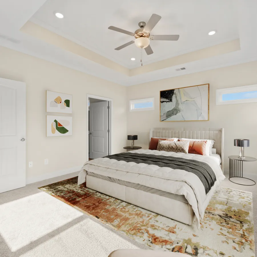 a bedroom with a bed and a fan
