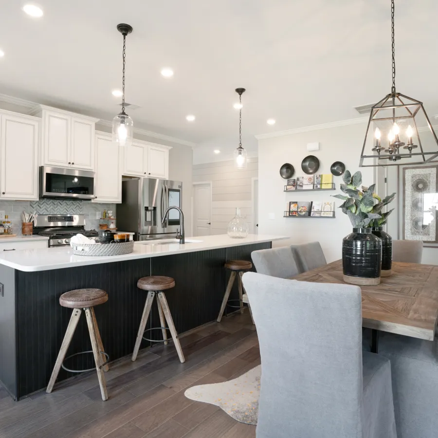 a kitchen with a dining room table