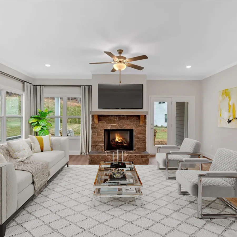 Modern living room with a cozy fireplace, stylish furniture, and large windows for natural light.