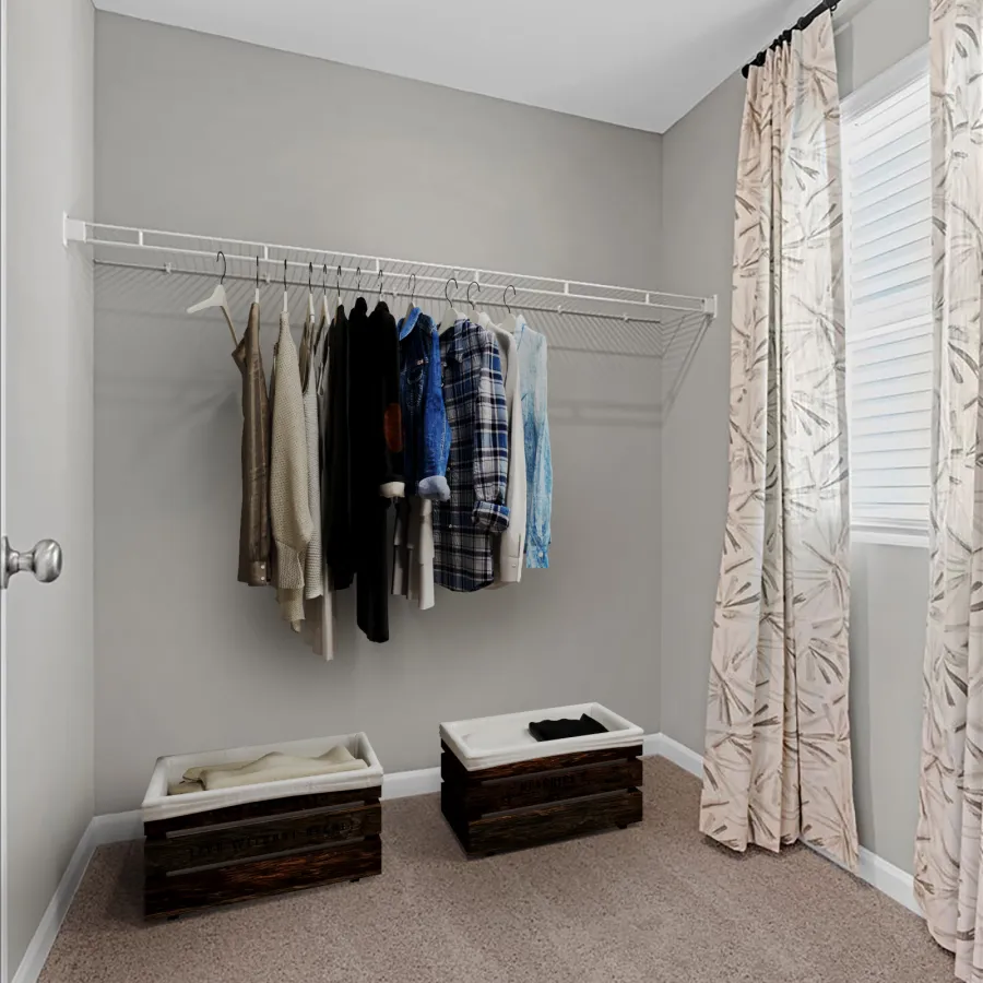 a room with a bed and a dresser