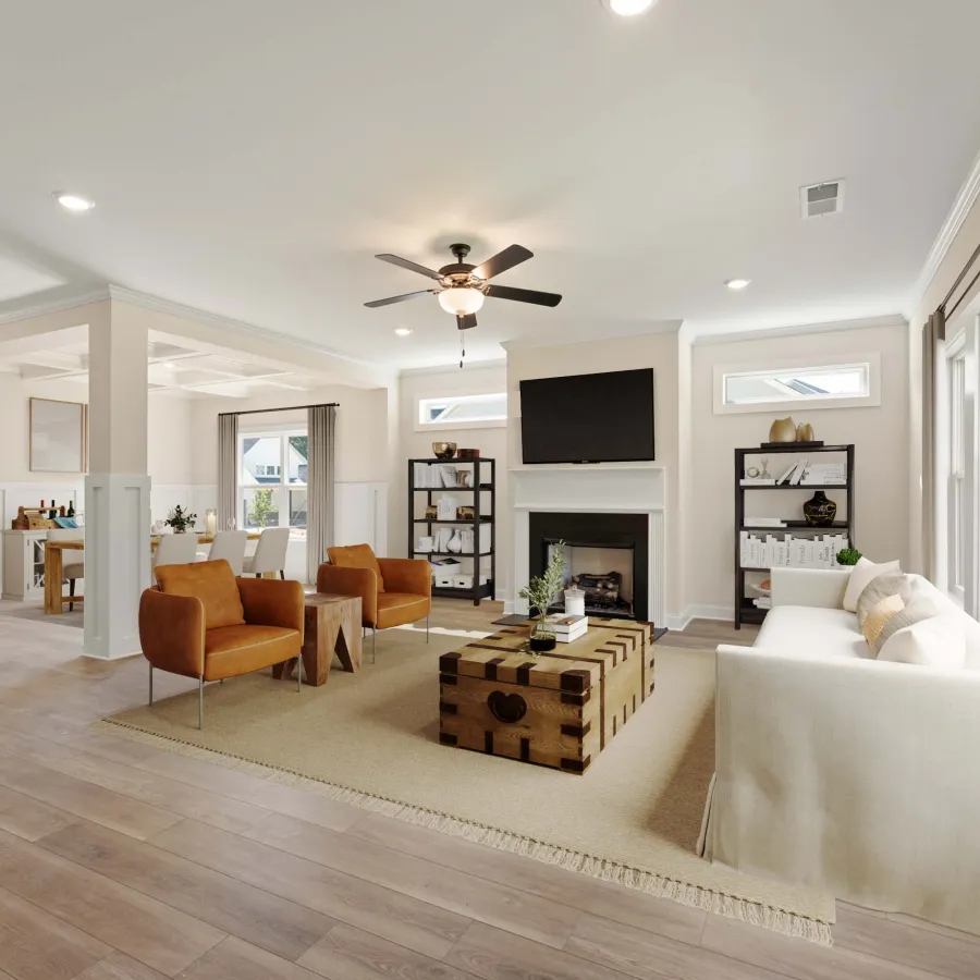 a living room with a large white couch and a wood floor