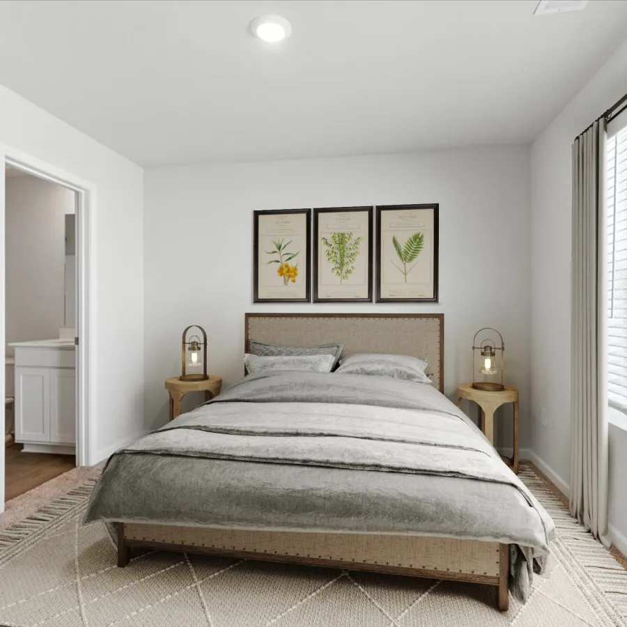 Minimalist bedroom with gray bedding, botanical prints above headboard, wooden side tables, and large window with blinds.