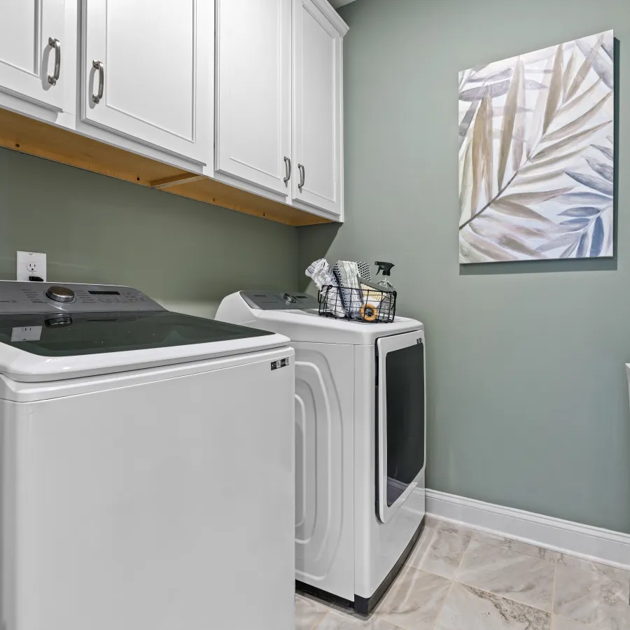a kitchen with white cabinets