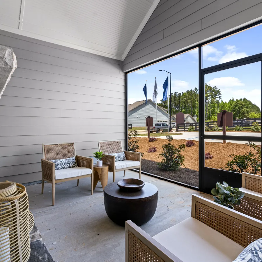 a room with a large window and a table with chairs and a table