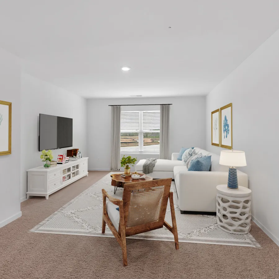 Bright living room with white walls, beige carpet, white sofa, wooden chair and decorative wall art.