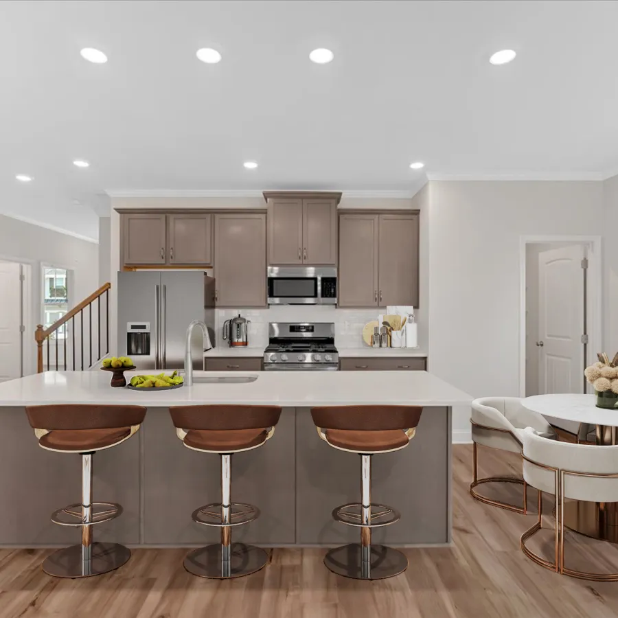 Stylish modern kitchen with island seating and sleek cabinetry in a bright, airy space.
