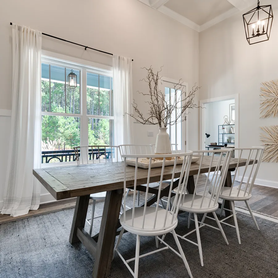 a room filled with furniture and a large window