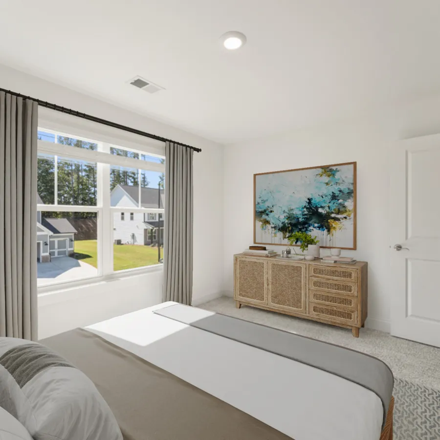 Bright bedroom with large window, beige curtains, rattan dresser, abstract art, and neutral bedding in a modern home.