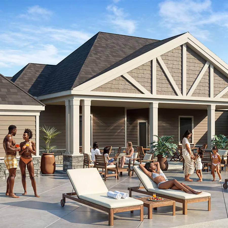 People relaxing and socializing by a poolside with lounge chairs and a large covered patio area on a sunny day