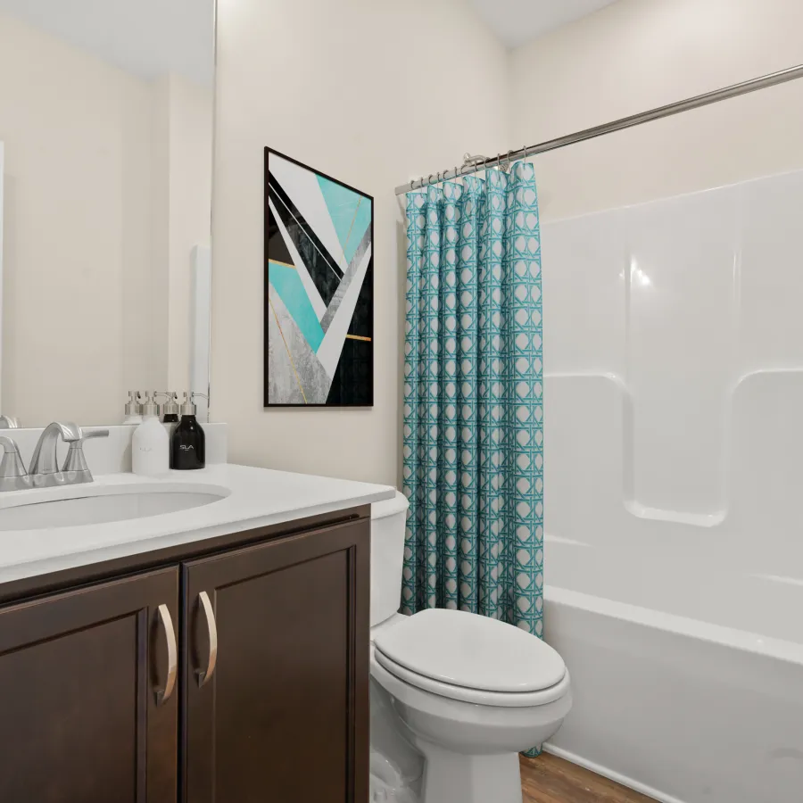 a bathroom with a shower and sink