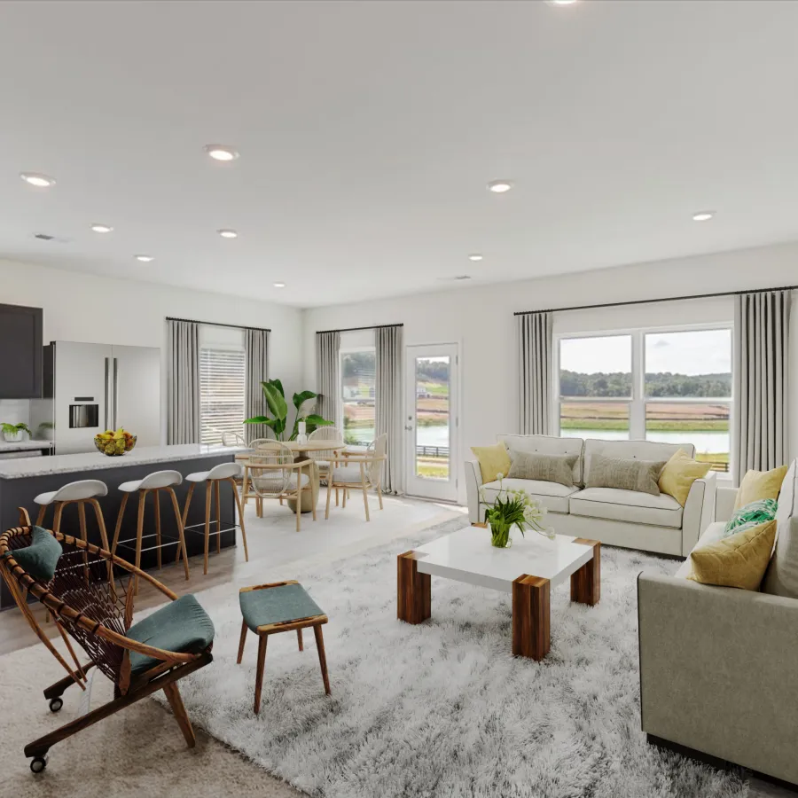 Bright open living room and kitchen with modern furniture, large windows, and a neutral color palette