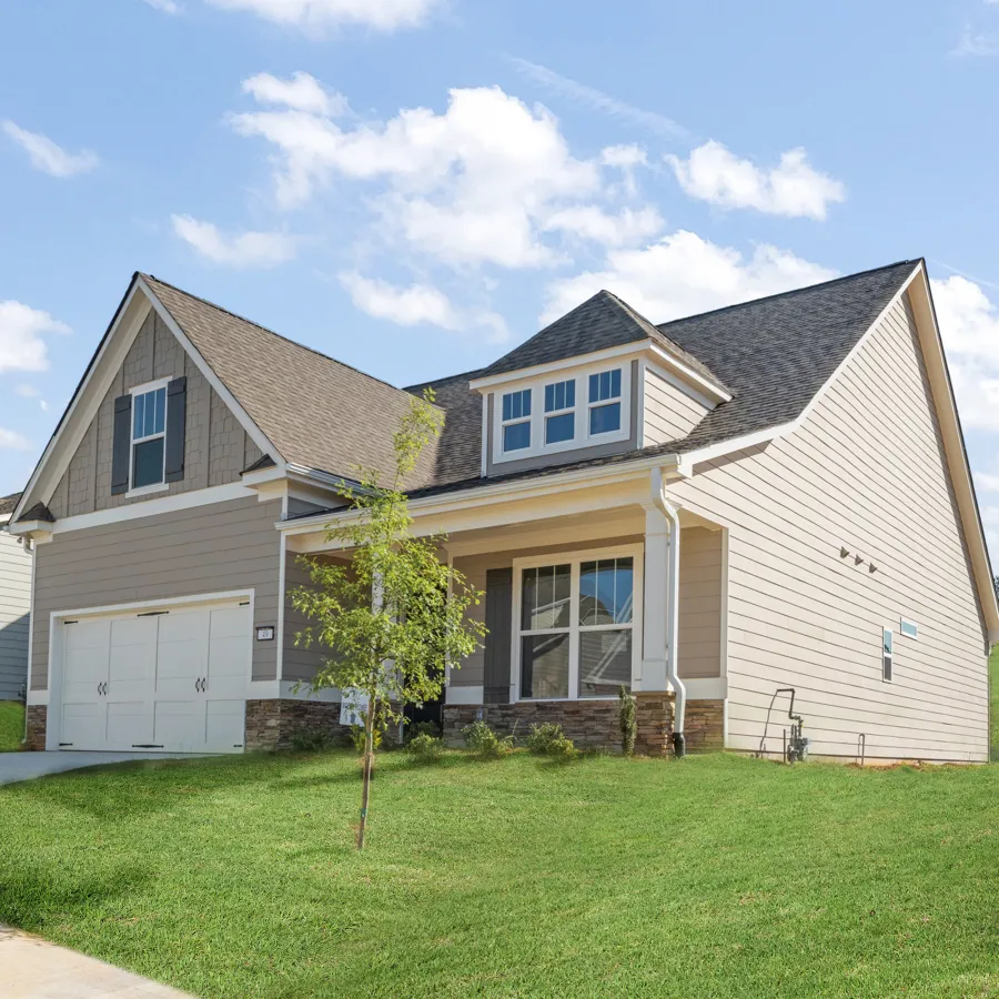 a house with a large front yard with Southfork Ranch in the background