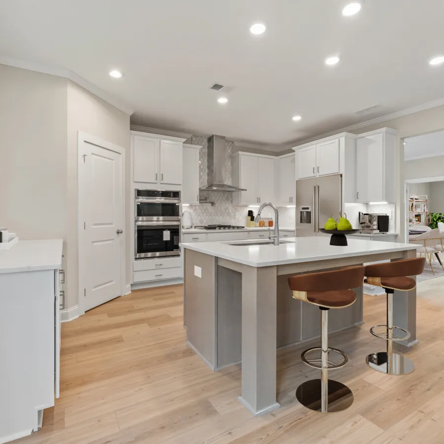 a kitchen with white cabinets