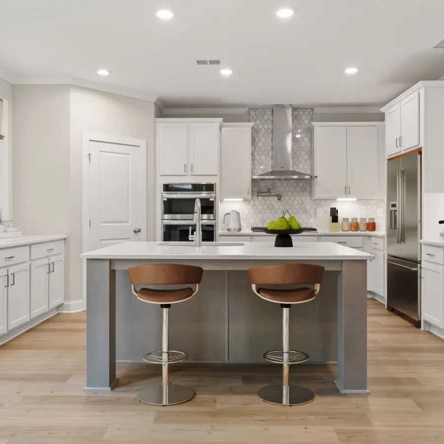 a kitchen with white cabinets