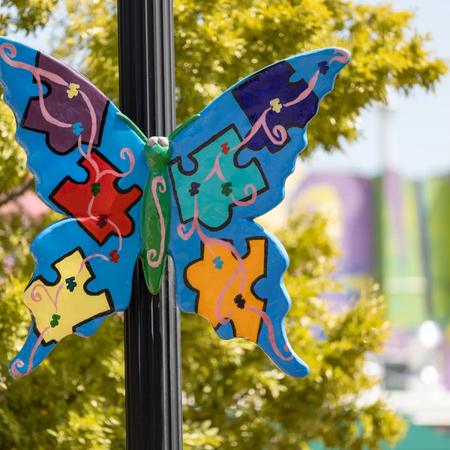 a couple of butterflies on a pole