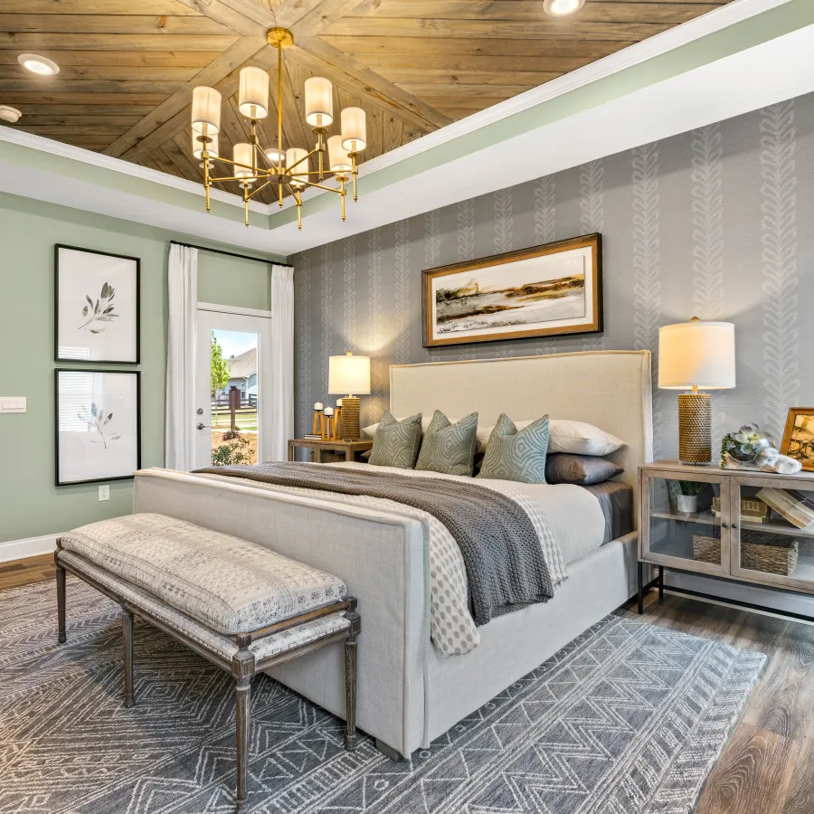 a bedroom with a bed and a bench