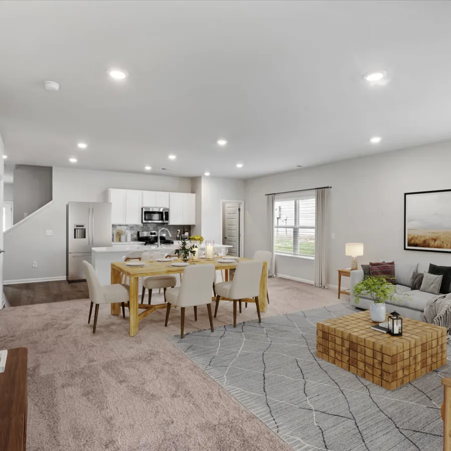 Modern open-plan living and dining area with neutral decor, white kitchen, wooden furniture, and soft lighting.