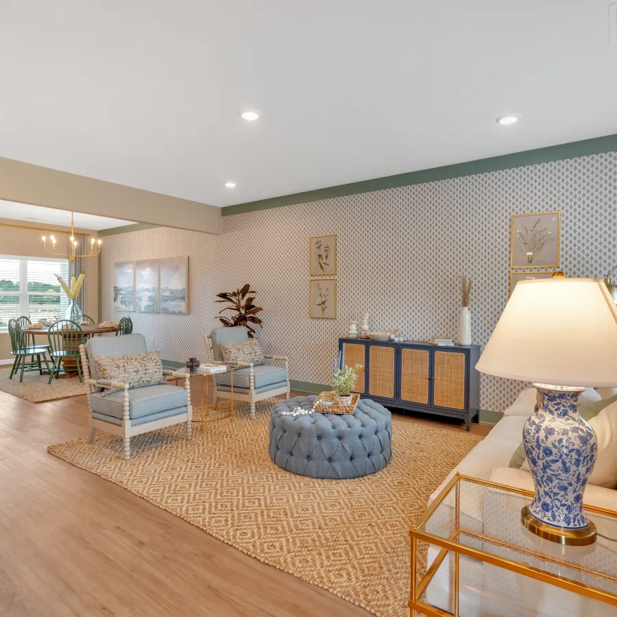 Bright and modern living room with stylish furniture and decorative accents.