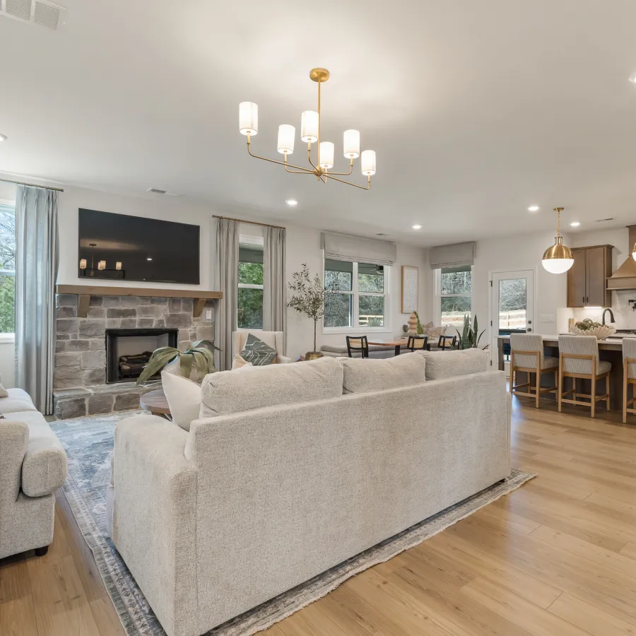 a large living room with a fireplace