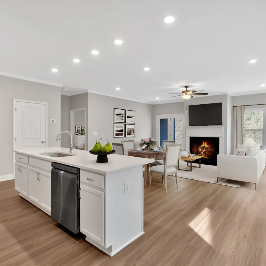 Open living space with modern kitchen island, dining area, and cozy living room with fireplace and TV.