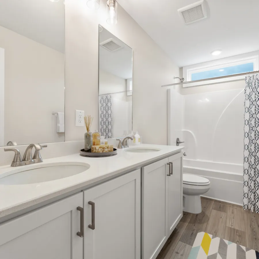 a bathroom with a tub sink and toilet