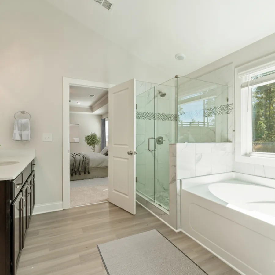 a bathroom with a tub sink and a toilet