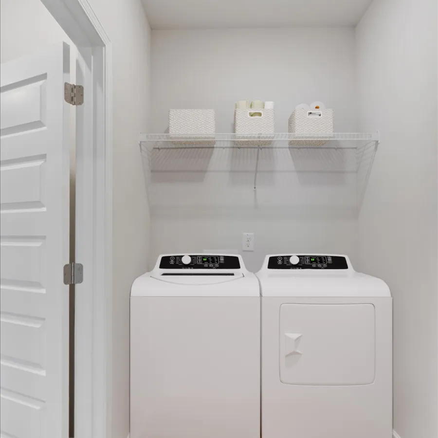 Modern laundry room with white washer and dryer, wooden floor, and white shelf with storage baskets.