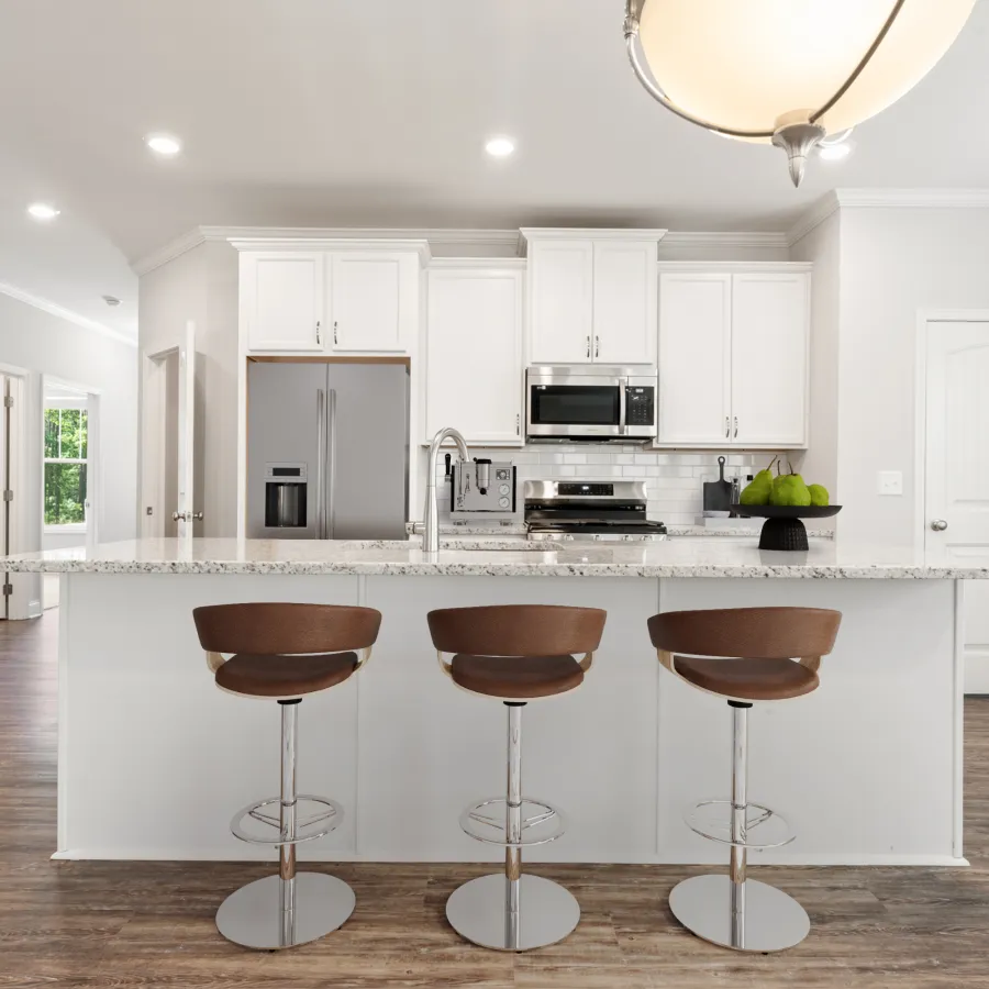 a kitchen with white cabinets