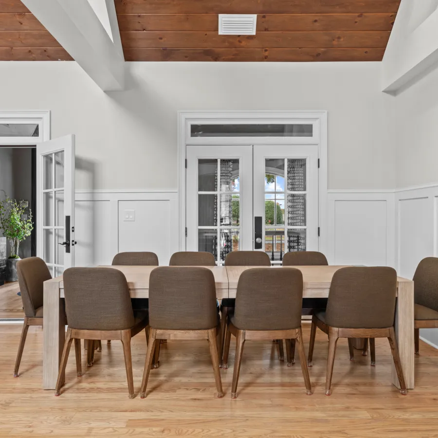 a dining room with a table and chairs