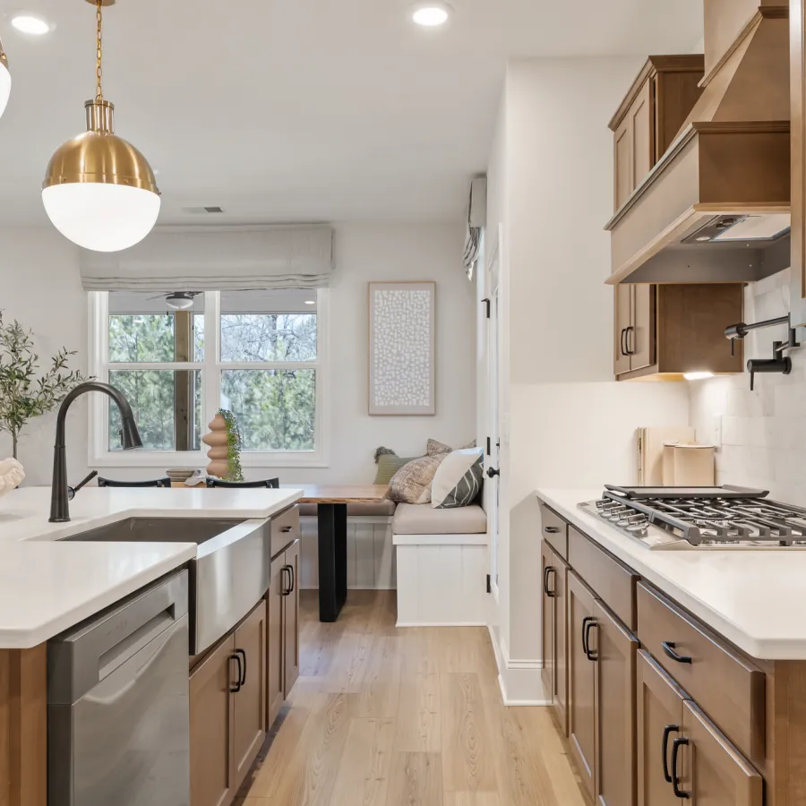 a kitchen with a sink and a bed