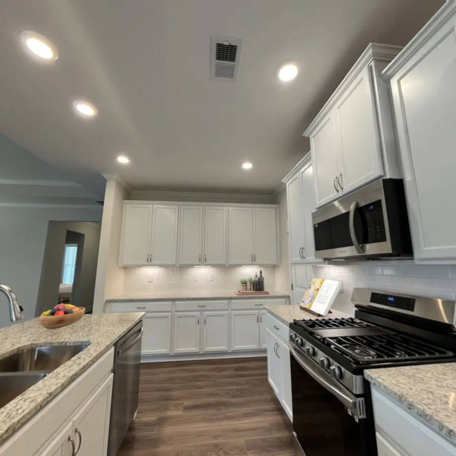 a kitchen with white cabinets