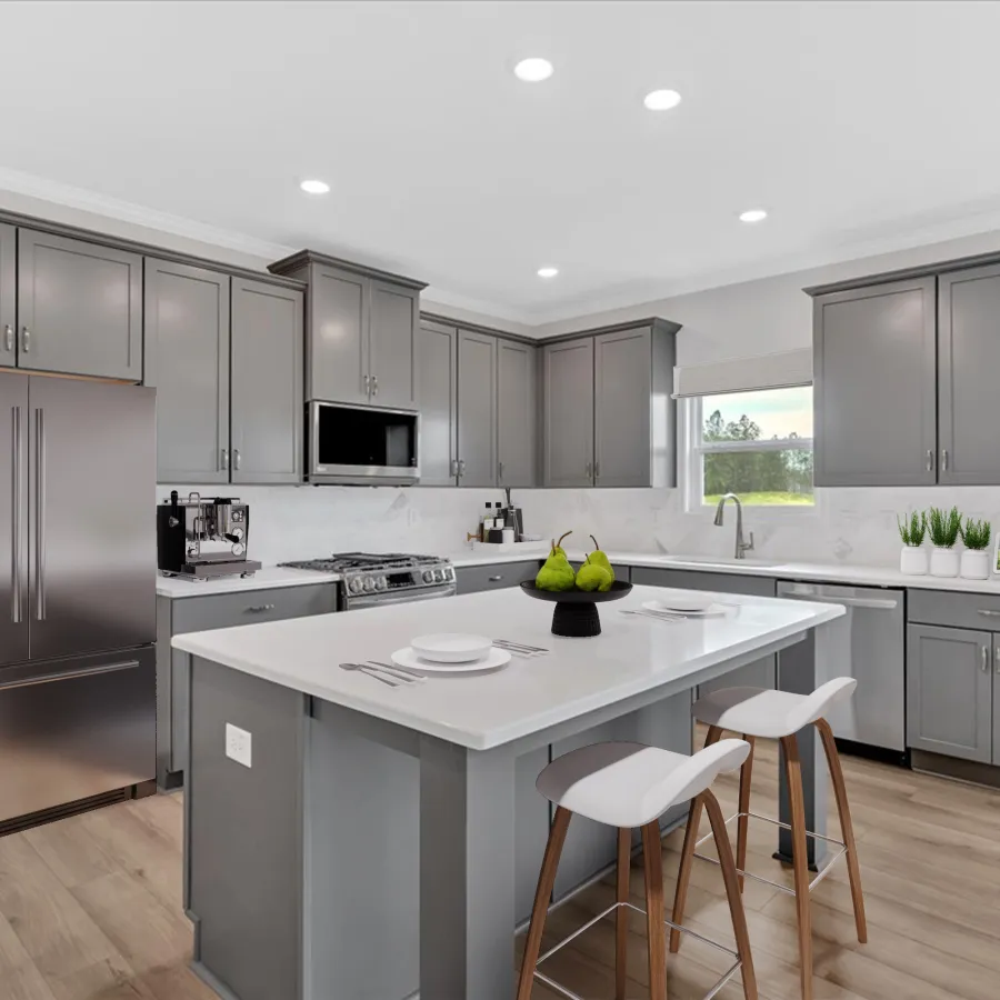 Modern gray kitchen with large island, stainless steel appliances, white countertops, and wood flooring under recessed lights
