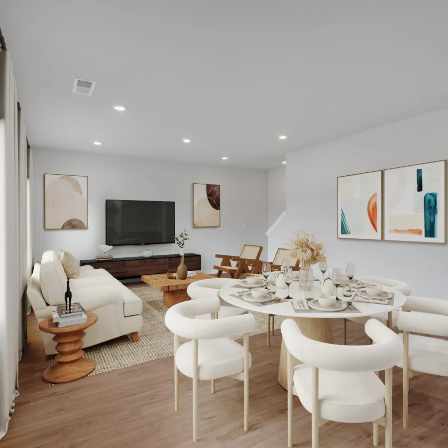 Modern open living room and dining area with neutral decor, white chairs, and abstract art on walls.