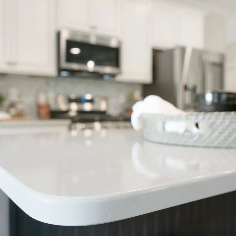 a kitchen with a sink and a mirror