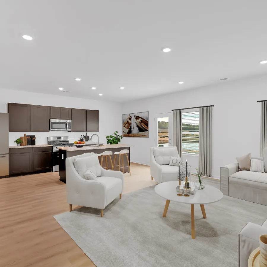 Modern open-concept living room and kitchen with neutral tones, white furniture, wooden flooring, and large windows.
