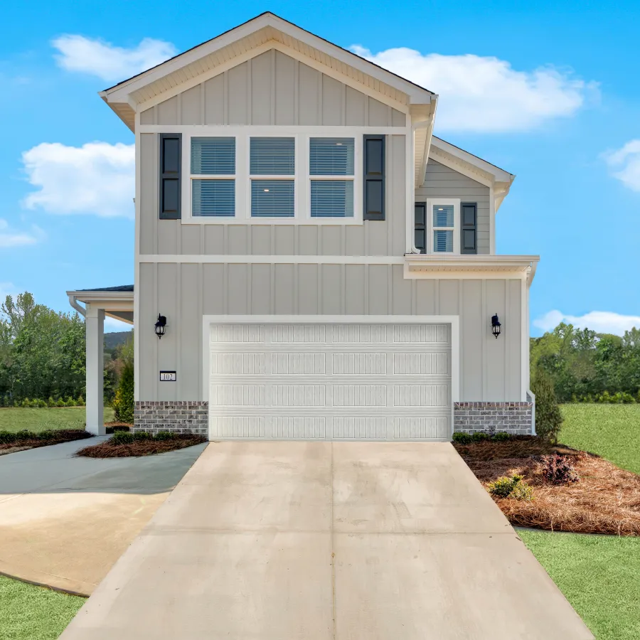 a white house with a garage