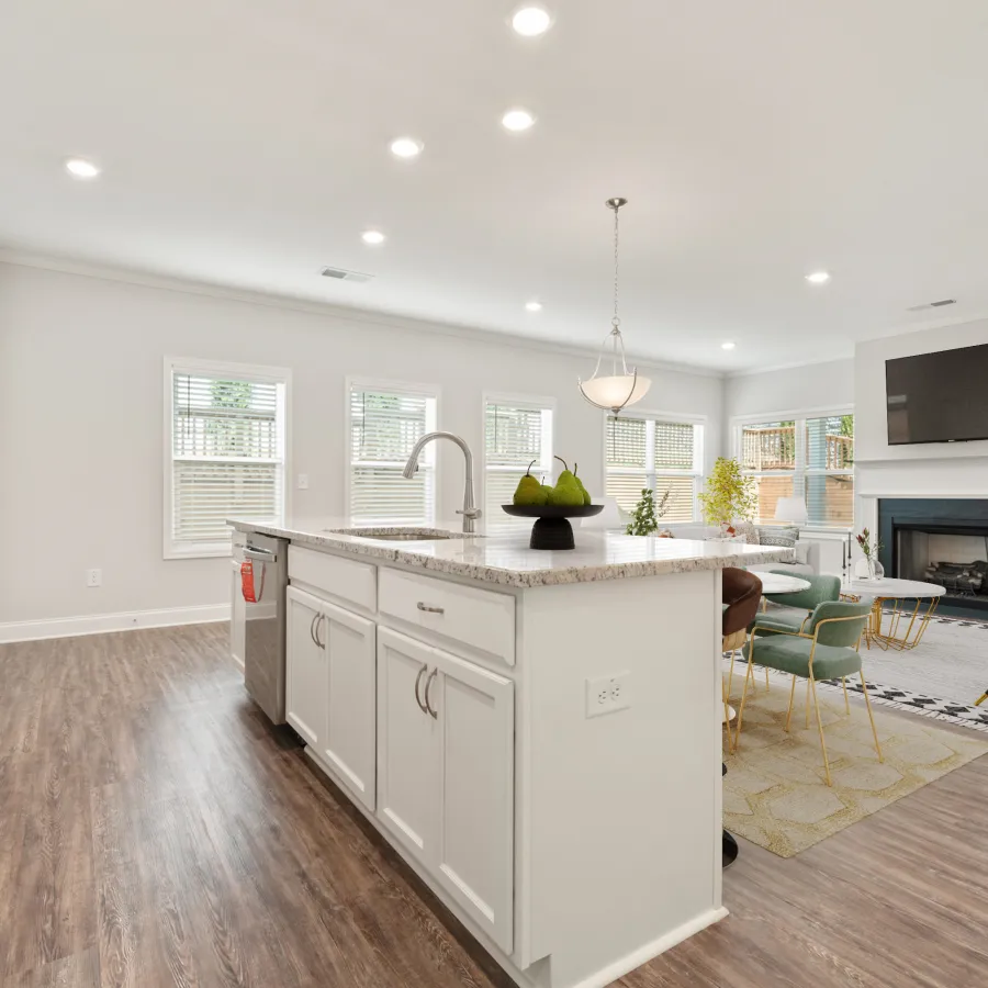 a kitchen with a fireplace and a dining table