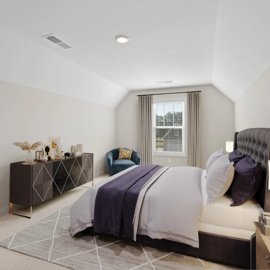 a bedroom with a couch and a table
