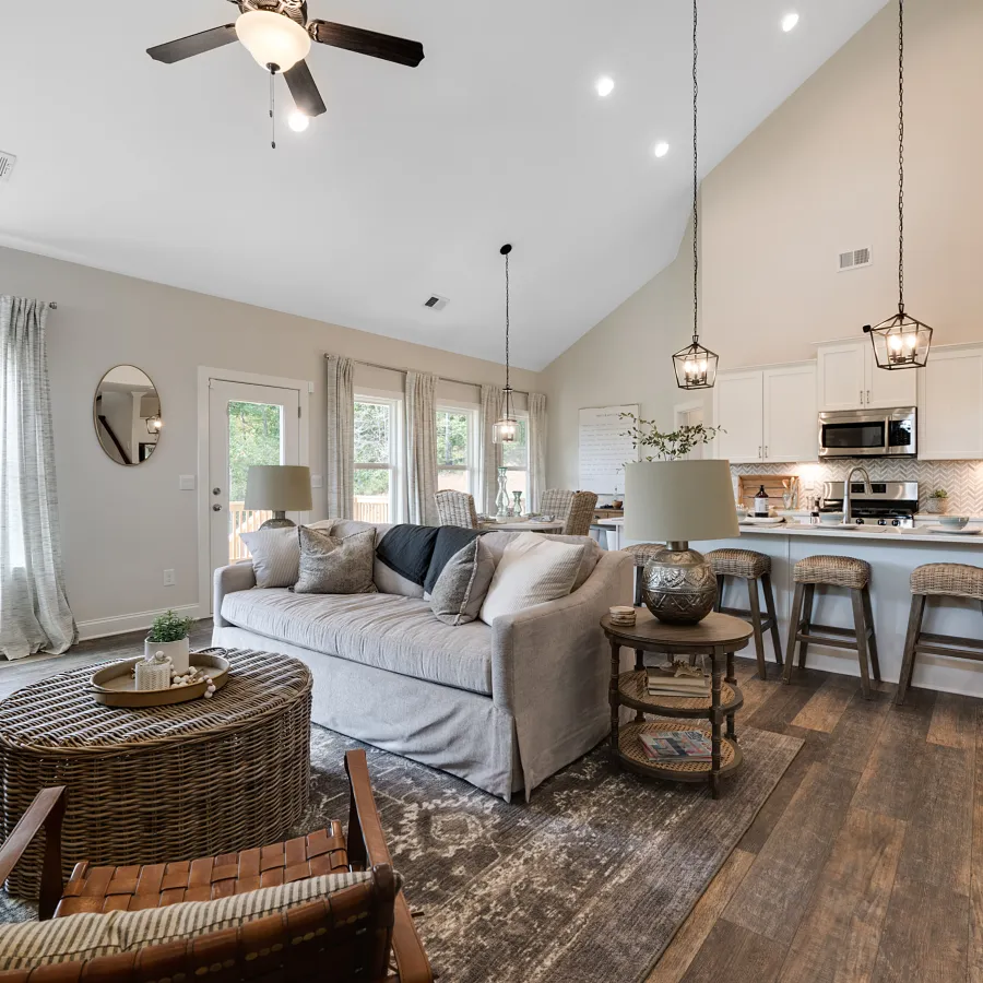a living room filled with furniture and a large window