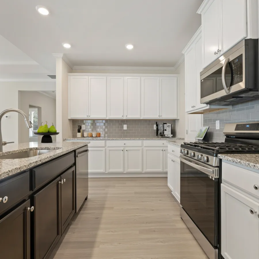 a kitchen with white cabinets