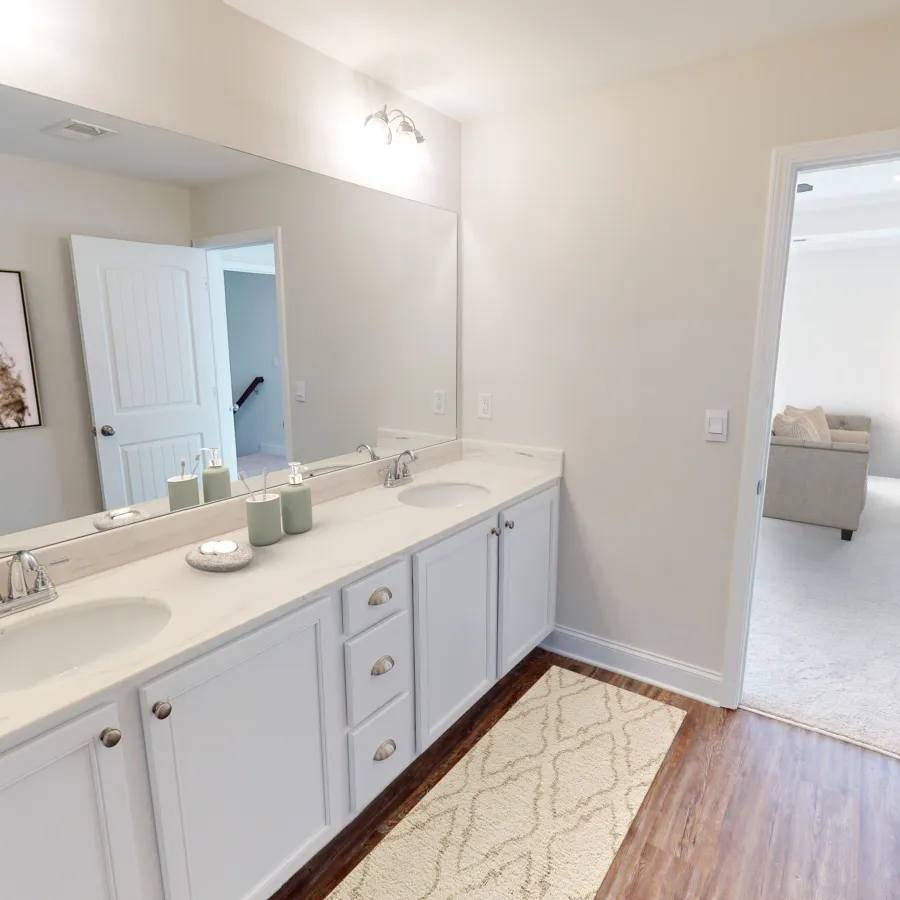 a kitchen with a sink and a mirror
