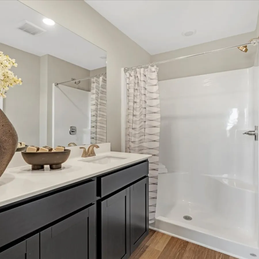 a bathroom with a tub and sink