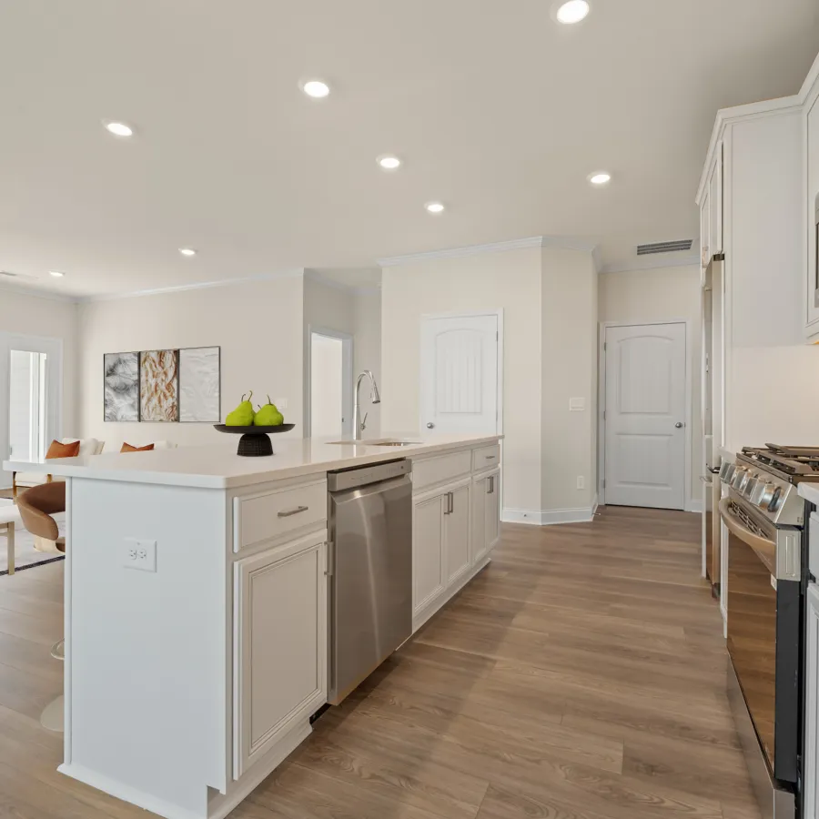 a kitchen with white cabinets
